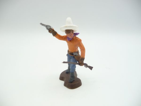 Britains Swoppets Cowboy going forward, firing pistol, holding rifle (orange shirt)
