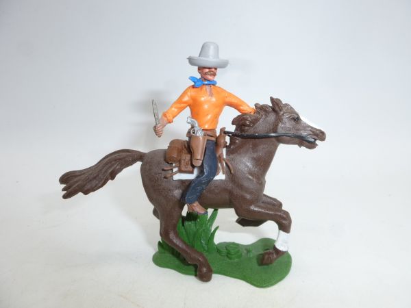 Britains Swoppets Cowboy riding with knife, another pistol in belt