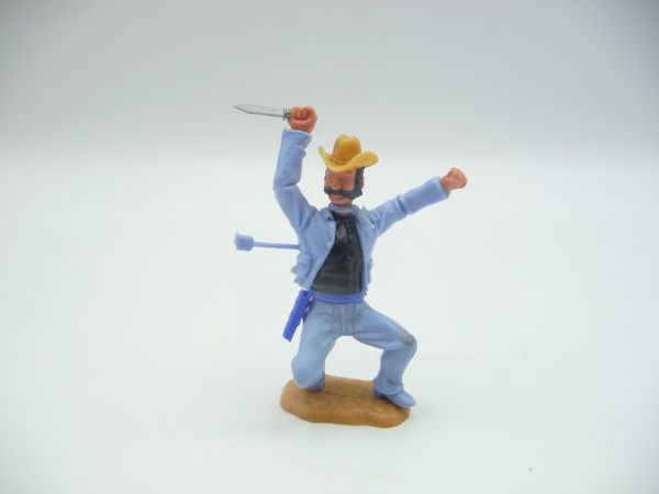 Timpo Toys Cowboy 3. Version hockend, von Pfeil getroffen, hellblau