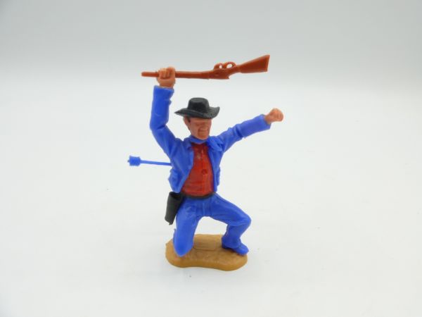 Timpo Toys Cowboy 3. Version hockend, von Pfeil getroffen - tolle Farbkombi