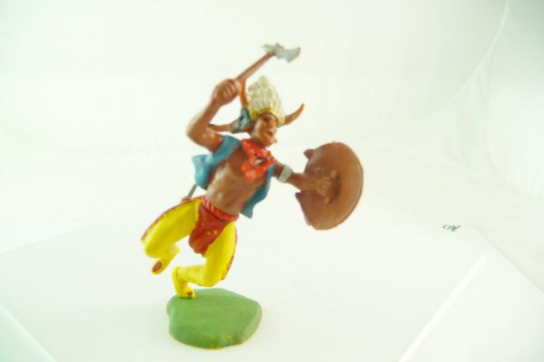 Britains Swoppets Indian attacking with tomahawk + shield, yellow trousers