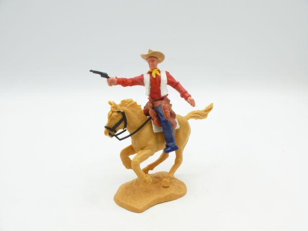 Timpo Toys Cowboy 2. Version reitend, Pistole schießend - Unterteil dunkelblau