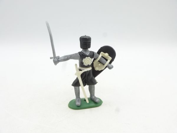 Medieval knight standing, black with sword