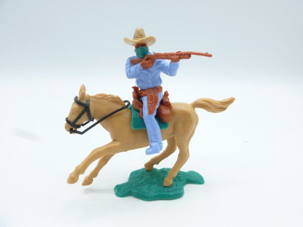 Timpo Toys Bandit on horseback, firing rifle, light blue, green cloth