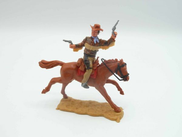 Timpo Toys Cowboy 4th version riding, firing wild with 2 pistols