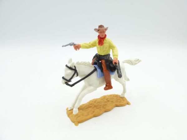 Timpo Toys Cowboy reitend mit Pistole + Geldtasche