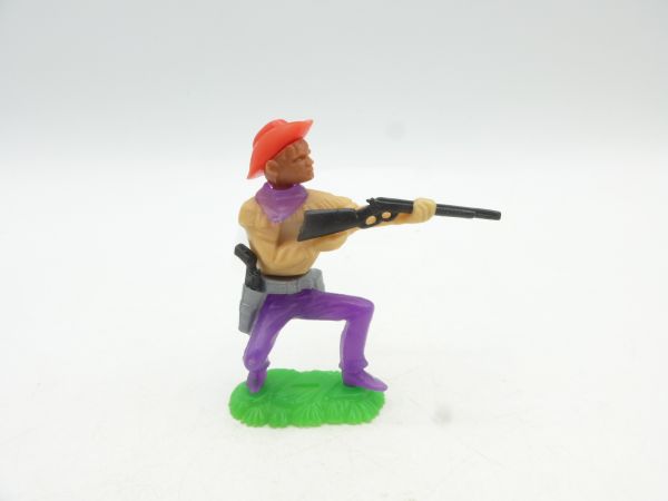 W. Germany / Jean Cowboy crouching, shooting rifle