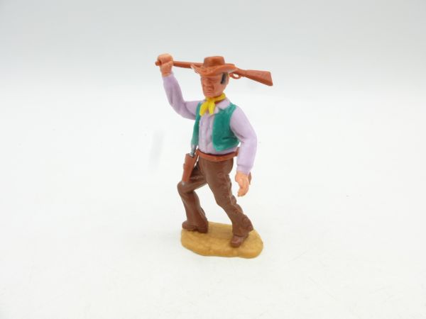 Timpo Toys Cowboy 3rd version advancing, striking with rifle