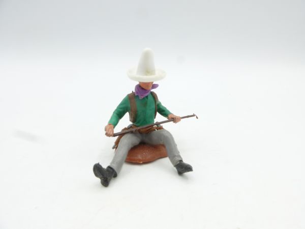 Britains Swoppets Cowboy sitting, rifle in front of body