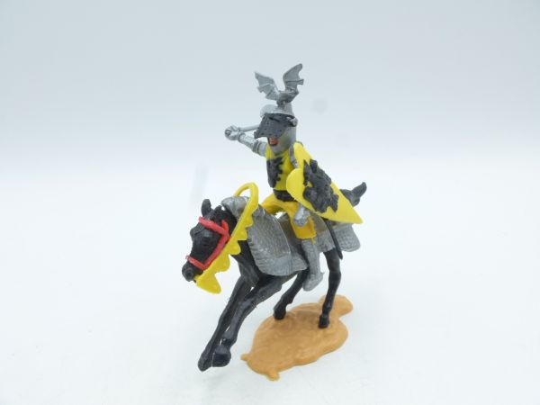 Timpo Toys Visor knight riding with battle axe, yellow, on armoured horse