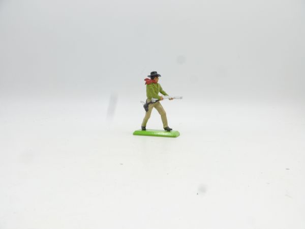 Britains Deetail Cowboy standing, shooting rifle from hip, lime green