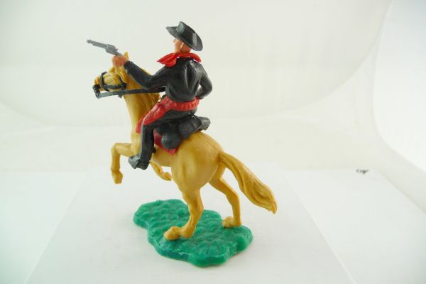 Timpo Toys Cowboy reitend mit seltenem schwarzem Unterteil, rote Hoster