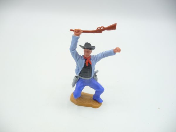Timpo Toys Cowboy 2. Version hockend, mit Gewehr zuschlagend - tolle Farbkombi