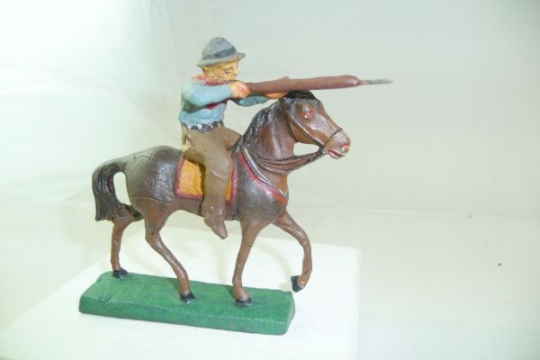 Elastolin Masse Cowboy riding, firing rifle forward - early figure
