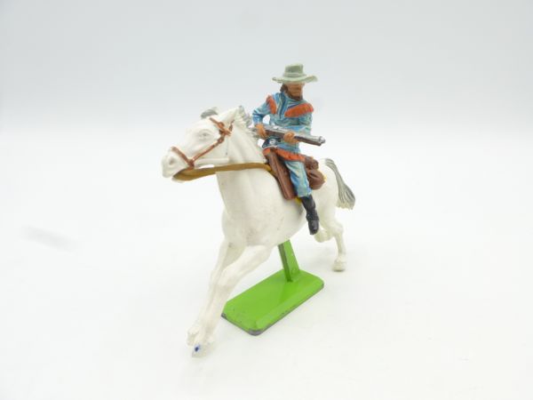 Britains Deetail Cowboy riding, rifle at side in front of body