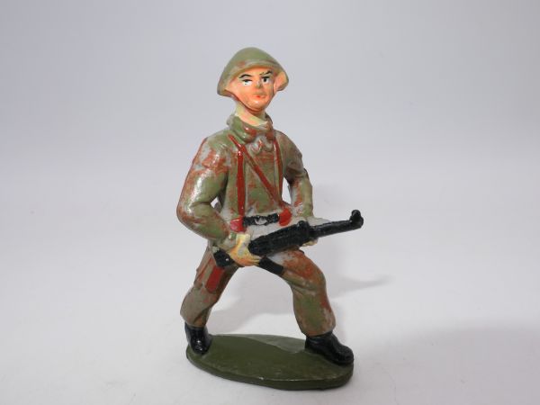 Soldier (camouflage uniform) with MP in front