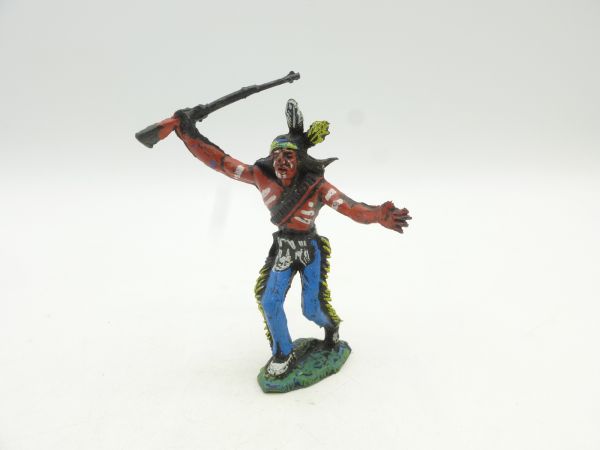 Chromoplast Indian dancing, holding rifle above head