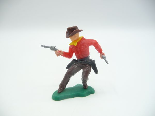 Cowboy standing with 2 pistols