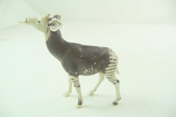 Britains Okapi, dark brown/white, with tongue out