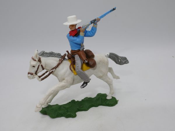 Britains Swoppets Cowboy (blue) on horseback shooting rifle