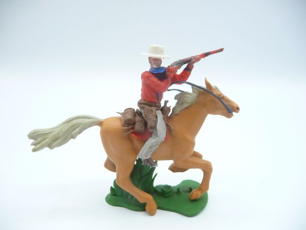Britains Swoppets Cowboy riding, firing rifle