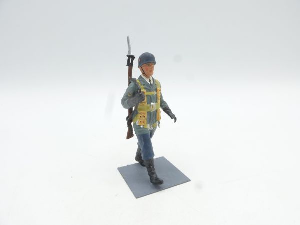 Soldier marching, rifle slung-on