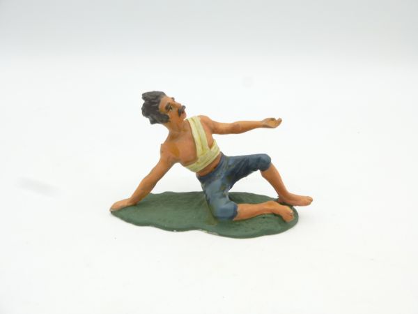 Wounded man lying sideways (figure 6 cm long), probably Britains