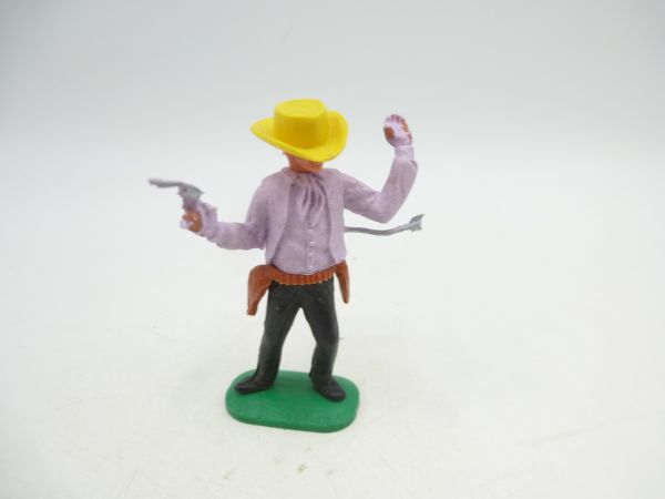 Timpo Toys Cowboy 1. Version von Pfeil getroffen, flieder, gelber Hut