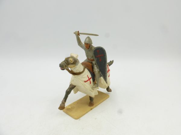 Knight on horseback with sword + shield