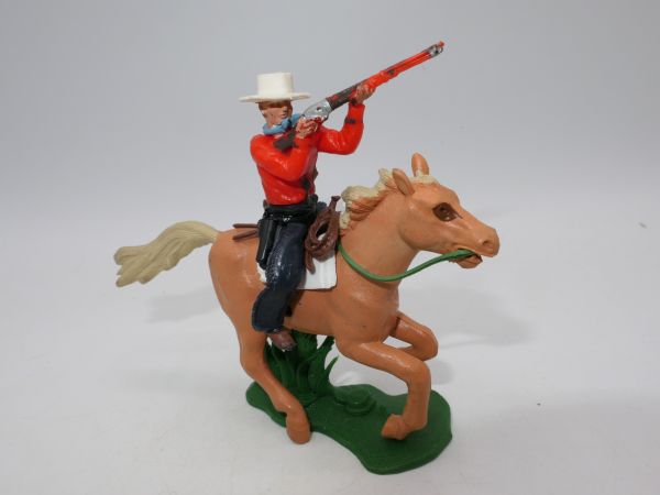 Britains Swoppets Cowboy (red) on horseback shooting rifle