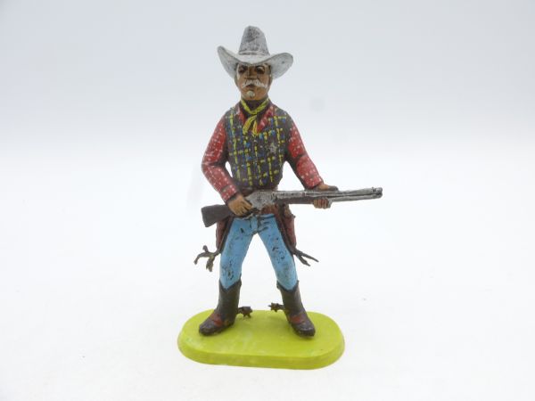 Chromoplast Cowboy mit Gewehr vor dem Körper, ca. 7,5 cm