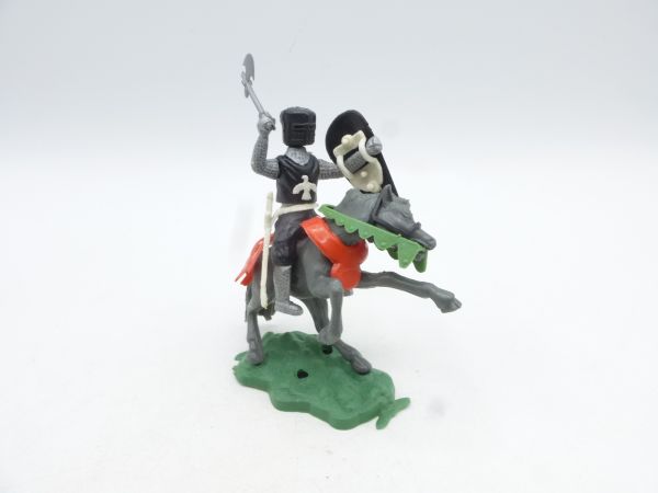 Medieval knight riding with battle axe, black