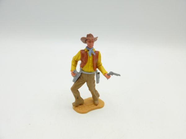 Timpo Toys Cowboy 2. Version mit 2 Pistolen schießend (gelbes Hemd, braune Weste)
