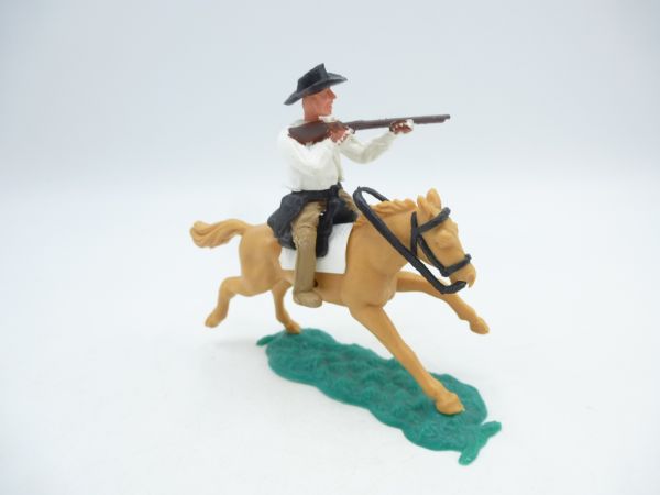 Timpo Toys Cowboy 1st version (small hat) riding, shooting rifle