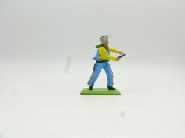 Britains Deetail Cowboy standing, shooting pistol ambidextrously, yellow/blue