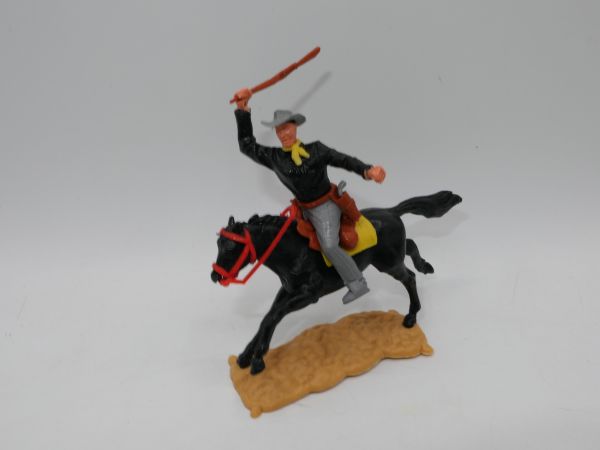 Timpo Toys Cowboy reitend, Gewehr schlagend
