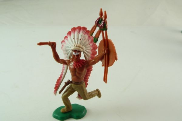 Indian Chief with long feather headdress with knife and spear