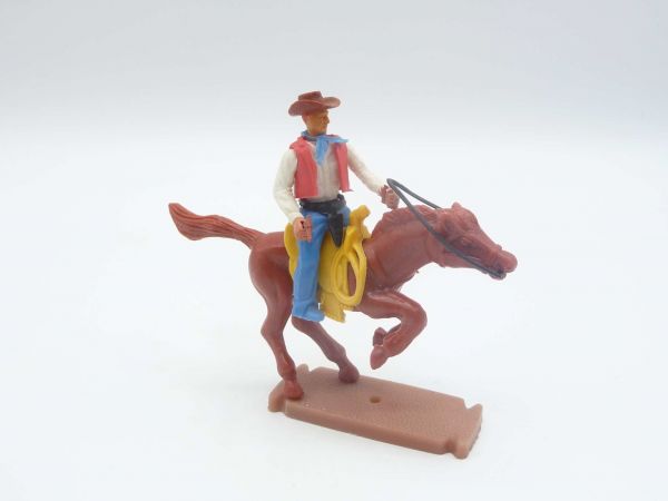 Plasty Cowboy reitend mit Pistole