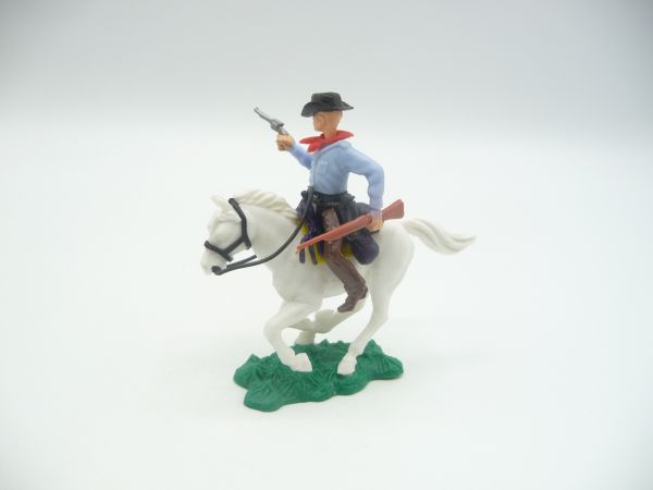 Cowboy riding with rifle + pistol, light blue