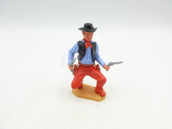 Timpo Toys Cowboy 3. Version hockend, 2 Pistolen schießend