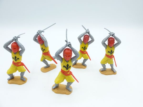 Timpo Toys 5 Mittelalterritter gelb, Schwert beidhändig über Kopf schlagend