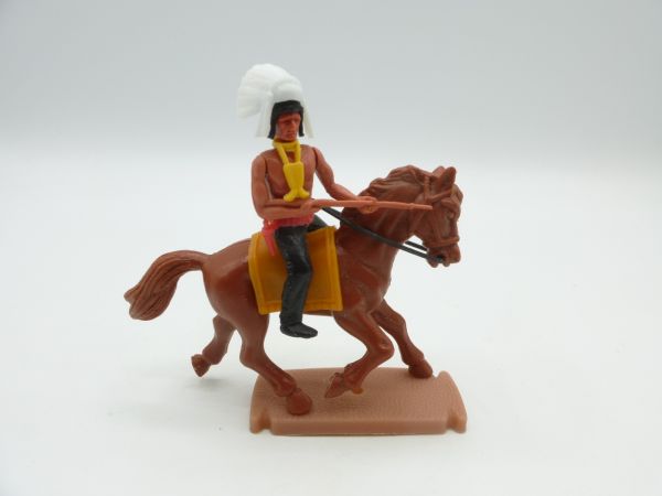 Plasty Indian riding, holding rifle sideways