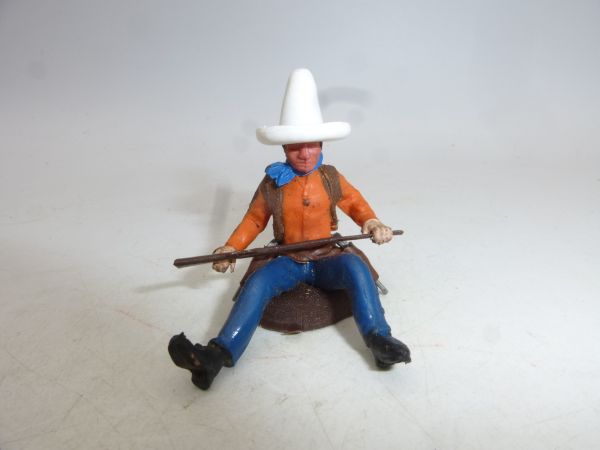Britains Swoppets Cowboy sitting on tree trunk, white Stetson