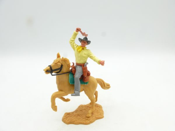 Timpo Toys Cowboy 2. Version reitend, Gewehr schlagend
