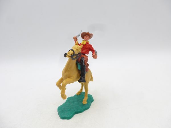 Timpo Toys Cowboy 2nd version riding, shooting 2 pistols wildly