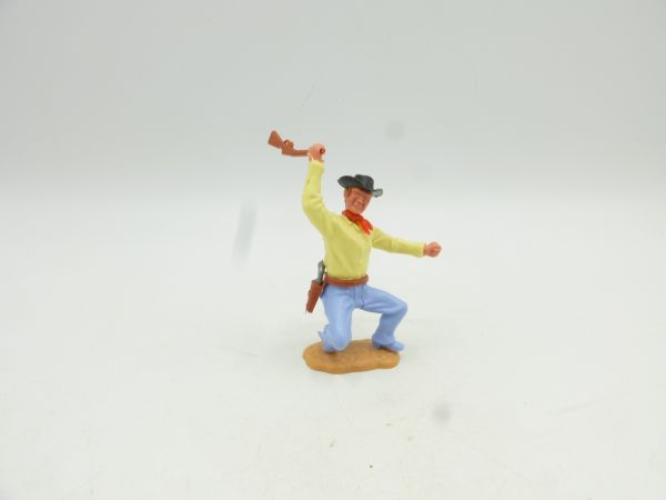 Timpo Toys Cowboy 3rd version crouching, firing rifle