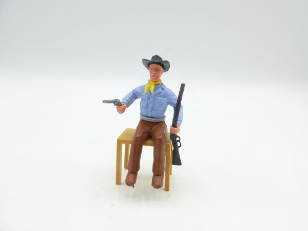 Timpo Toys Cowboy 2. Version sitzend mit Pistole + schwarzer Winchester