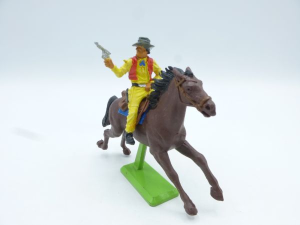 Britains Deetail Cowboy riding, firing pistol at side