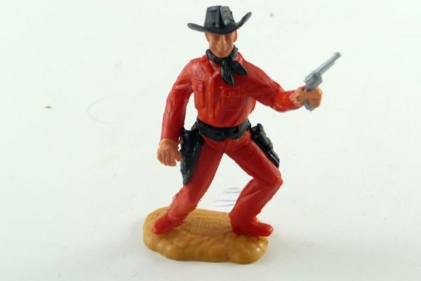Timpo Toys Cowboy breitbeinig stehend rotes Unterteil mit schwarzem Holster