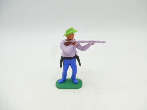 Timpo Toys Cowboy 1. Version, flieder, Gewehr schießend
